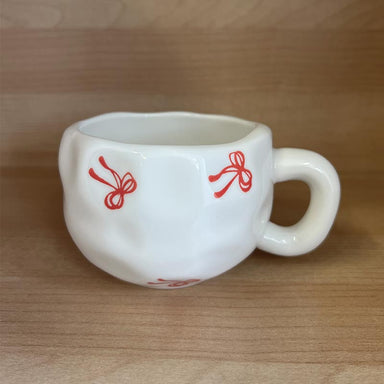 Garcia Yuna Ceramic Mug - Red Bows | Koop.co.nz