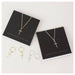 Lindi Kingi Deluxe Exalted Cross Necklace - Gold | Koop.co.nz